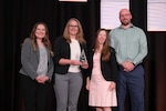 Amanda McCullough, Technological Transfer Agreements Program Manager at NSWC Crane (pictured left), at the awards ceremony for 2026 Technology Transfer Rookie of the Year Award.
