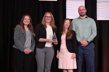 Amanda McCullough, Technological Transfer Agreements Program Manager at NSWC Crane (pictured left), at the awards ceremony for 2026 Technology Transfer Rookie of the Year Award.