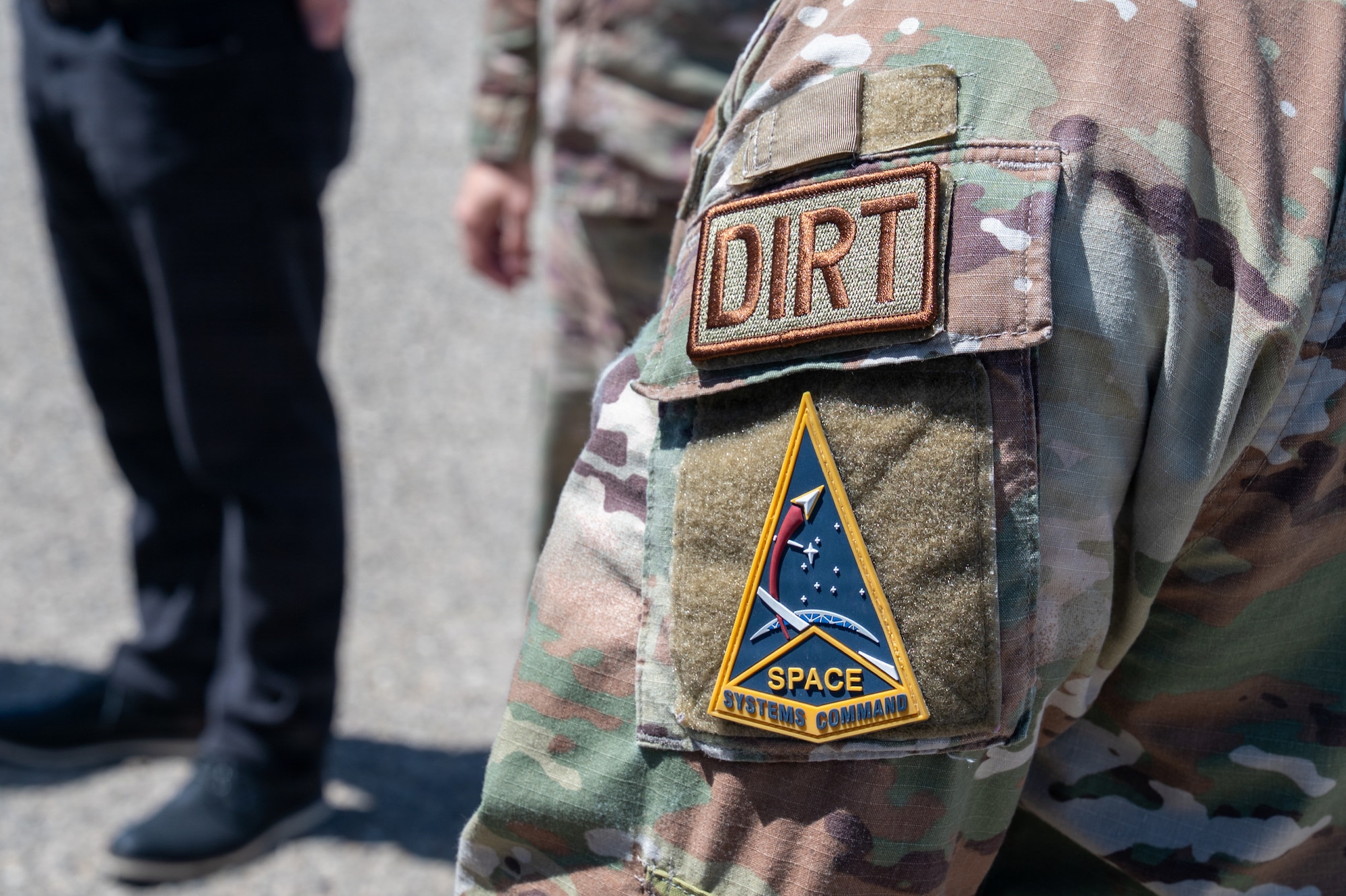 A servicemember's left sleeve with their patch in focus.