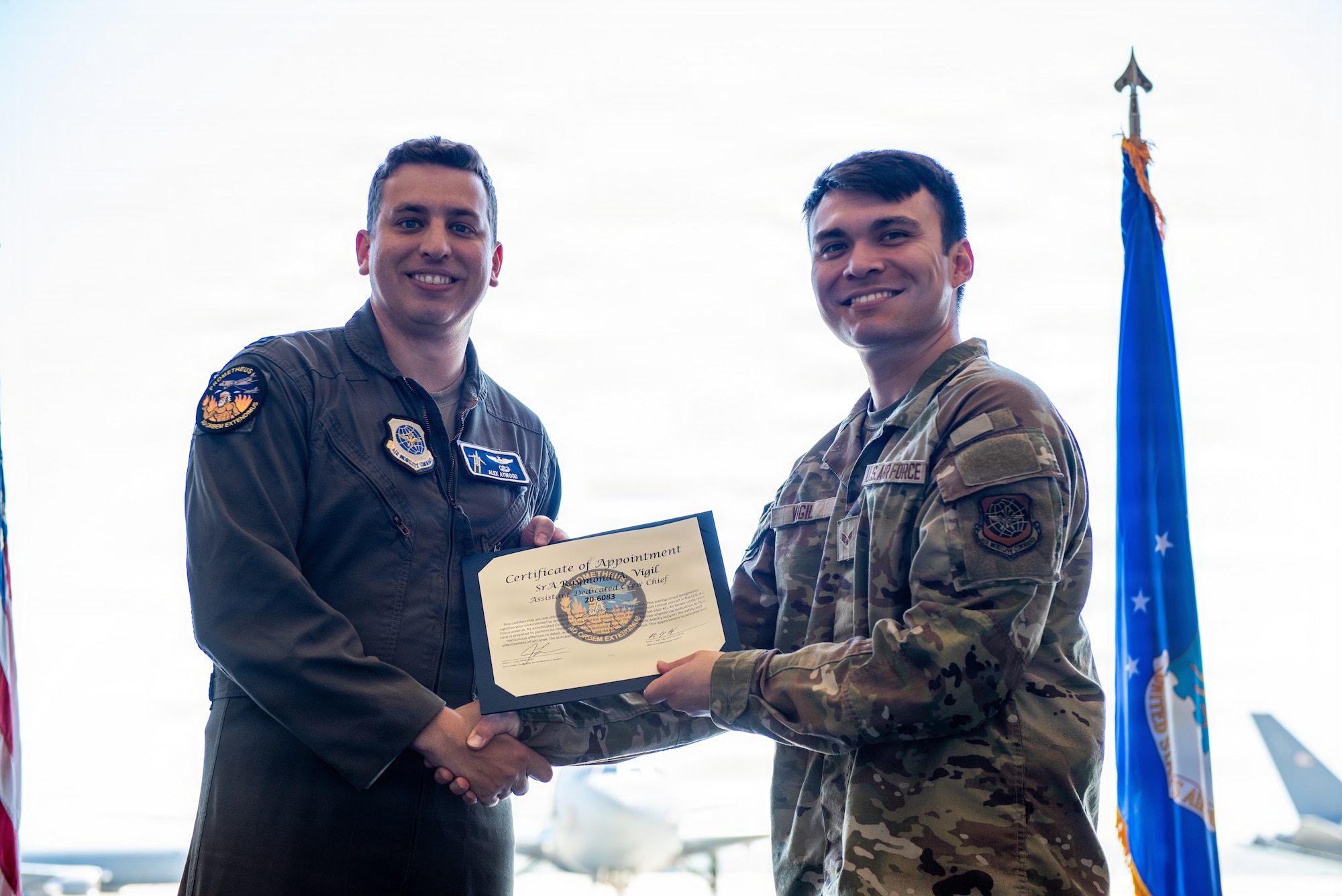 Aircraft pilot presents certificate to dedicated crew chief