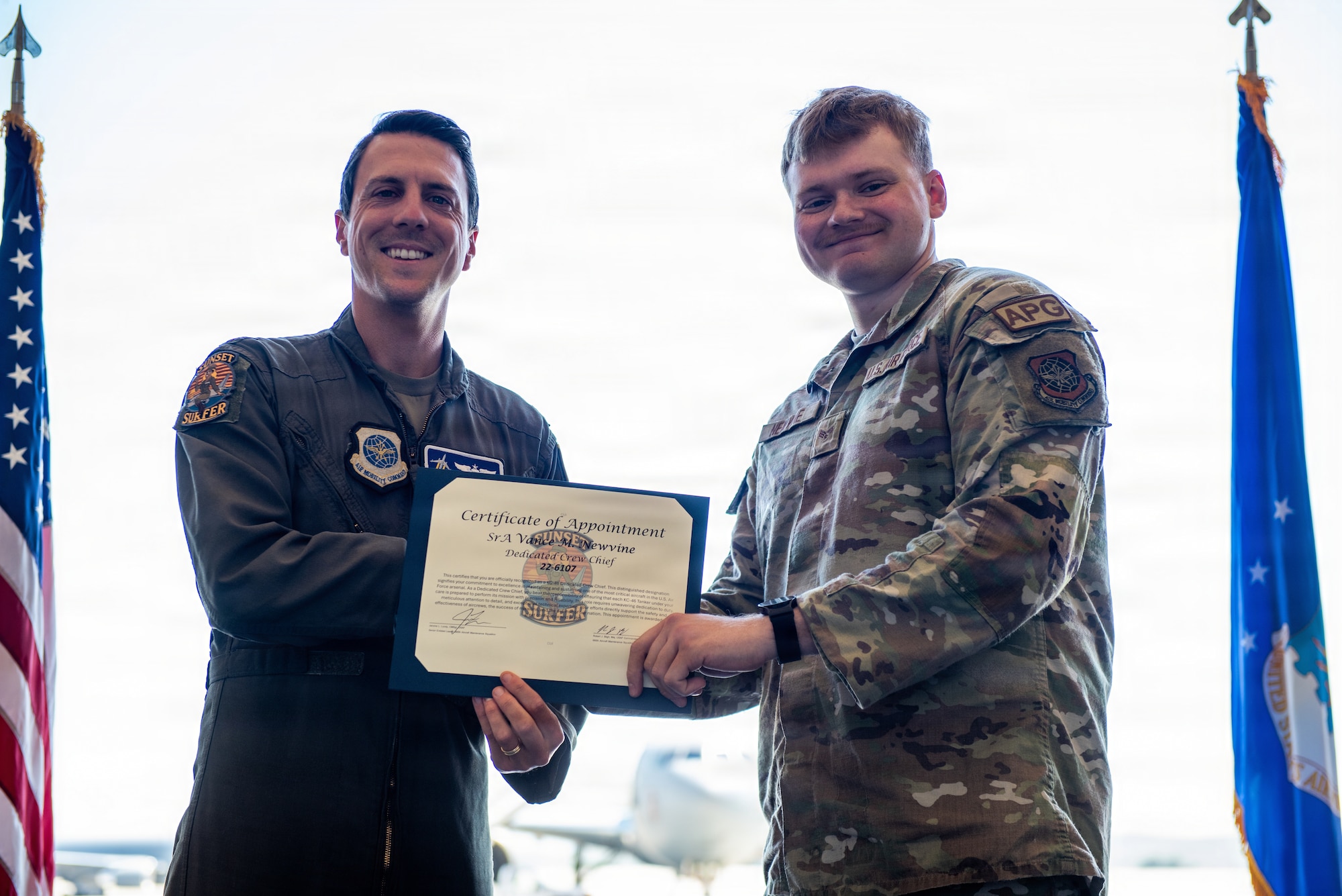 Aircraft pilot presents certificate to dedicated crew chief