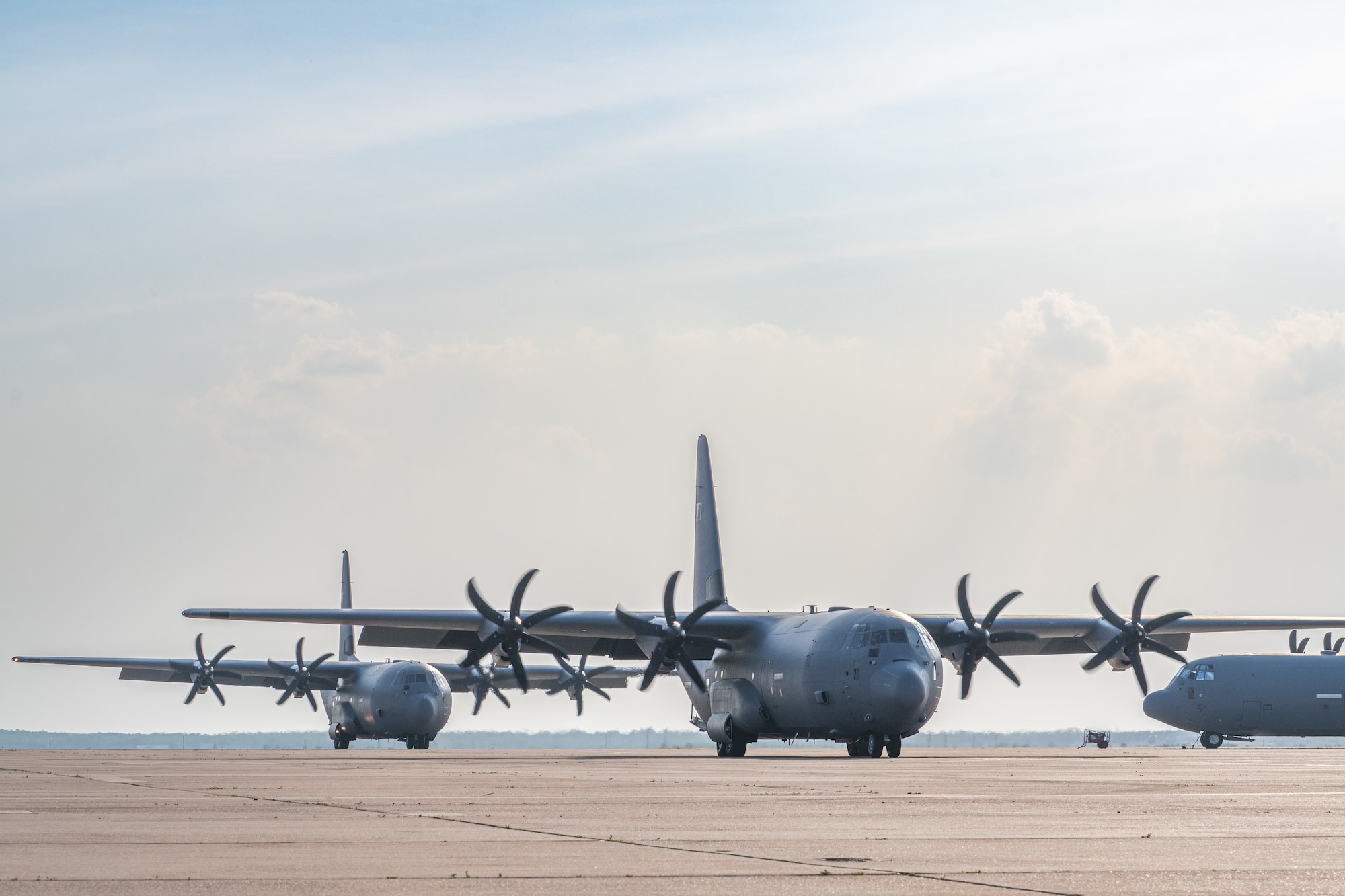 U.S. Air Force C-130J Super Hercules aircraft assigned to the 317th Airlift Wing taxi on the flightline after returning from a deployment at Dyess Air Force Base, Texas, May 18, 2026. The return highlights the unit’s continued commitment to delivering rapid global mobility and sustaining operations in support of combatant commands worldwide. (U.S. Air Force photo by Airman 1st Class Caleb Schellenberg)