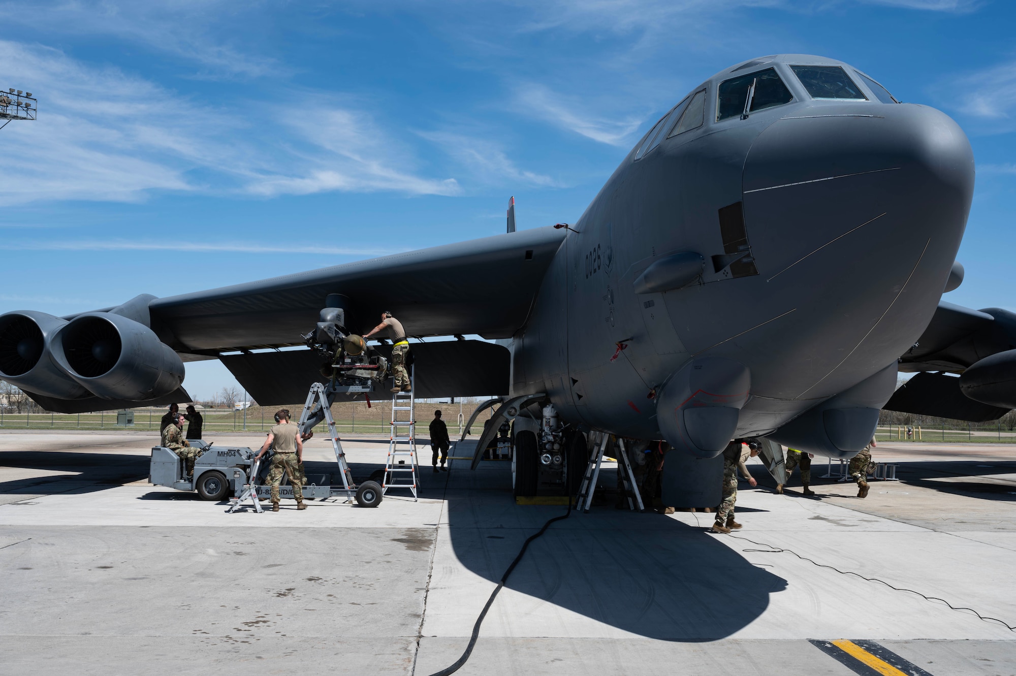 U.S. Airmen assigned to the 5th Maintenance Group load munitions onto a B-52H Stratofortress during Warbird Week at Minot Air Force Base, North Dakota, May 13, 2026. The B-52 is capable of dropping or launching the widest array of weapons in the U.S. inventory. (U.S. Air Force photo by Senior Airman Kyle Wilson)