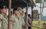 The Peruvian Army Jungle School Director Col. Persi Fernandez Alata (center left), U.S. Army Col. Jared Koelling (center right), and U.S. Army Western Hemisphere Command planners attend the opening ceremony of Jungle Operations Monitor Course class AF-2026 on May 5, 2026, at the school in Sauce, Peru. The PERAR, in partnership with the U.S. Army Western Hemisphere Command, is hosting Argentinean and Chilean soldiers to train alongside Peruvian and American soldiers at the Jungle School for the premiere exercise Southern Vanguard 2026 as proof of enduring commitment to regional partnership and to strengthen multi-component forces for complex operations in a jungle environment. (U.S. Army National Guard photo by Staff Sgt. Zoe Morris)