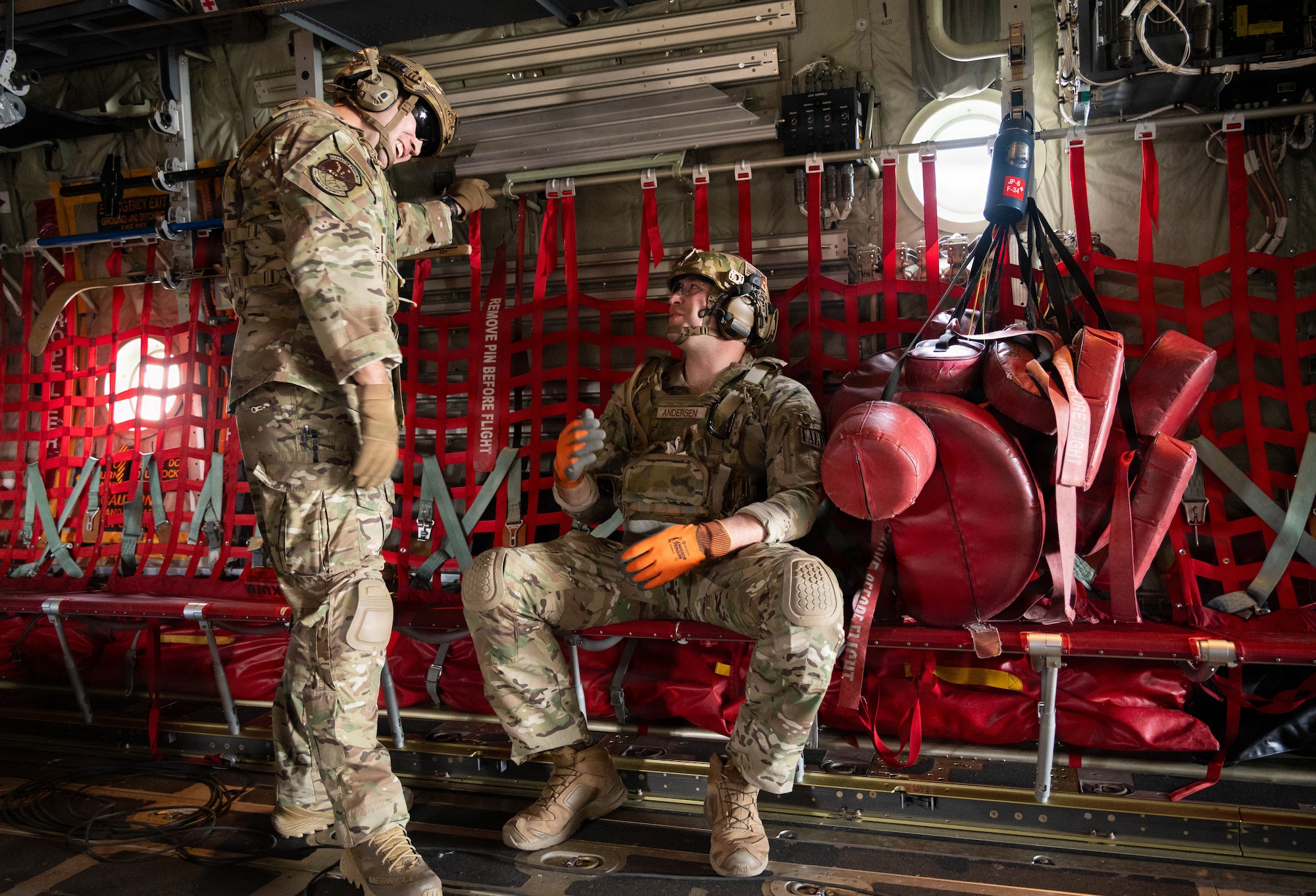 U.S. Air Force Master Sgt. Tyler Vasquez, left, 176th Logistics Readiness Squadron fuels management specialist, and Tech. Sgt. Devan Andersen, 176th LRS noncommissioned officer in charge of fuels distribution, discuss a forward arming and refueling point operation prior to execution at Joint Base Elmendorf-Richardson, Alaska, May 15, 2026.