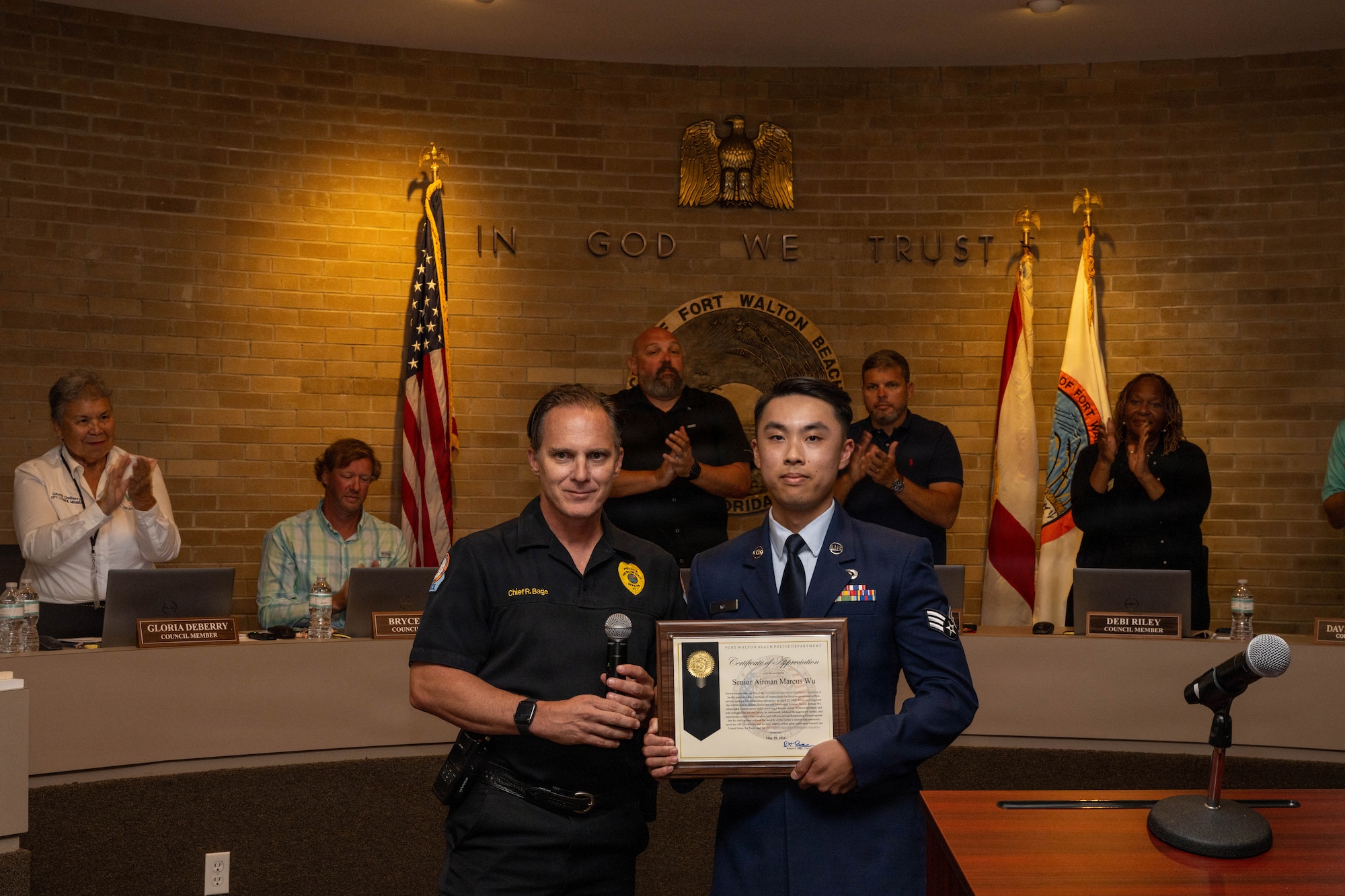 Airman poses with chief of police
