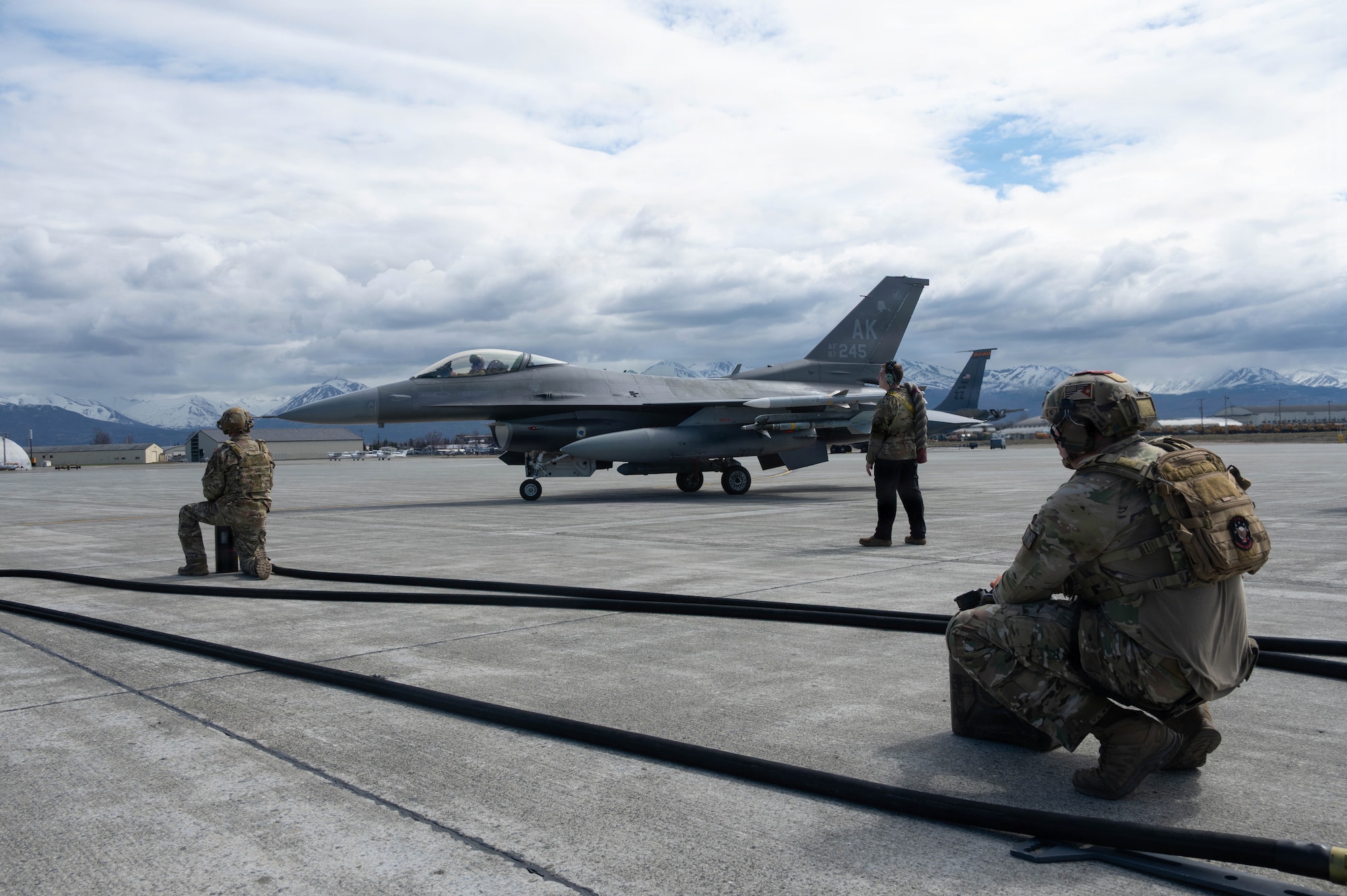 A U.S. Air Force F-16 Fighting Falcon assigned to 18th Fighter Interceptor Squadron taxis into place for refueling by Airmen from the 18th FIS and 176th Logistics Readiness Squadron during a forward arming and refueling point operation at Joint Base Elmendorf-Richardson, Alaska, May 15, 2026.