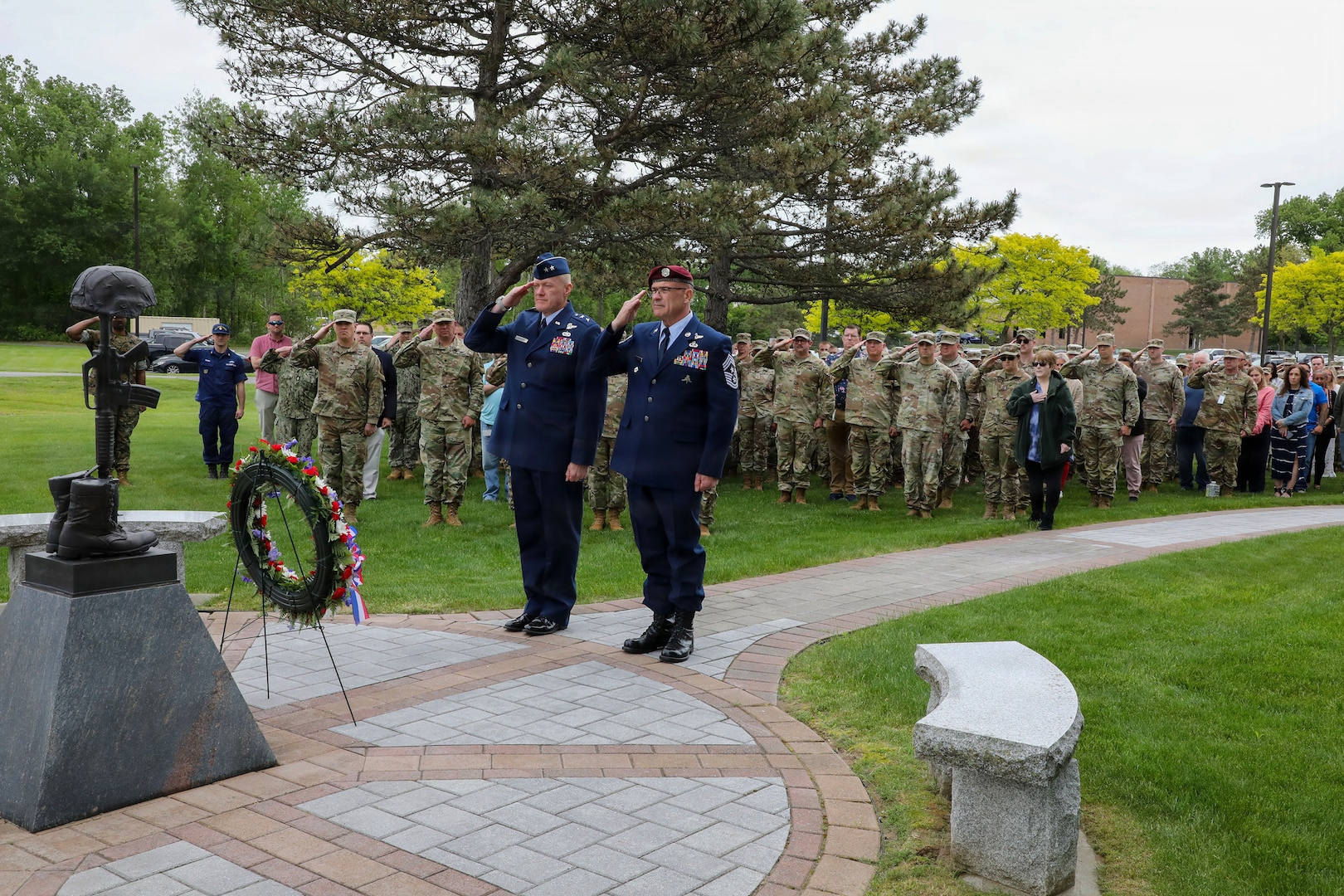 Air National Guard Major General Gary Charlton, commander of the New York Air National Guard, left, and Command Chief Master Sergeant Michael Hewson salute while taps played during the New York National Guard headquarters Memorial Day ceremony in Latham, New York, on May 21, 2026.