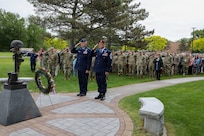 Air National Guard Major General Gary Charlton, commander of the New York Air National Guard, left, and Command Chief Master Sergeant Michael Hewson salute while taps played during the New York National Guard headquarters Memorial Day ceremony in Latham, New York, on May 21, 2026.
