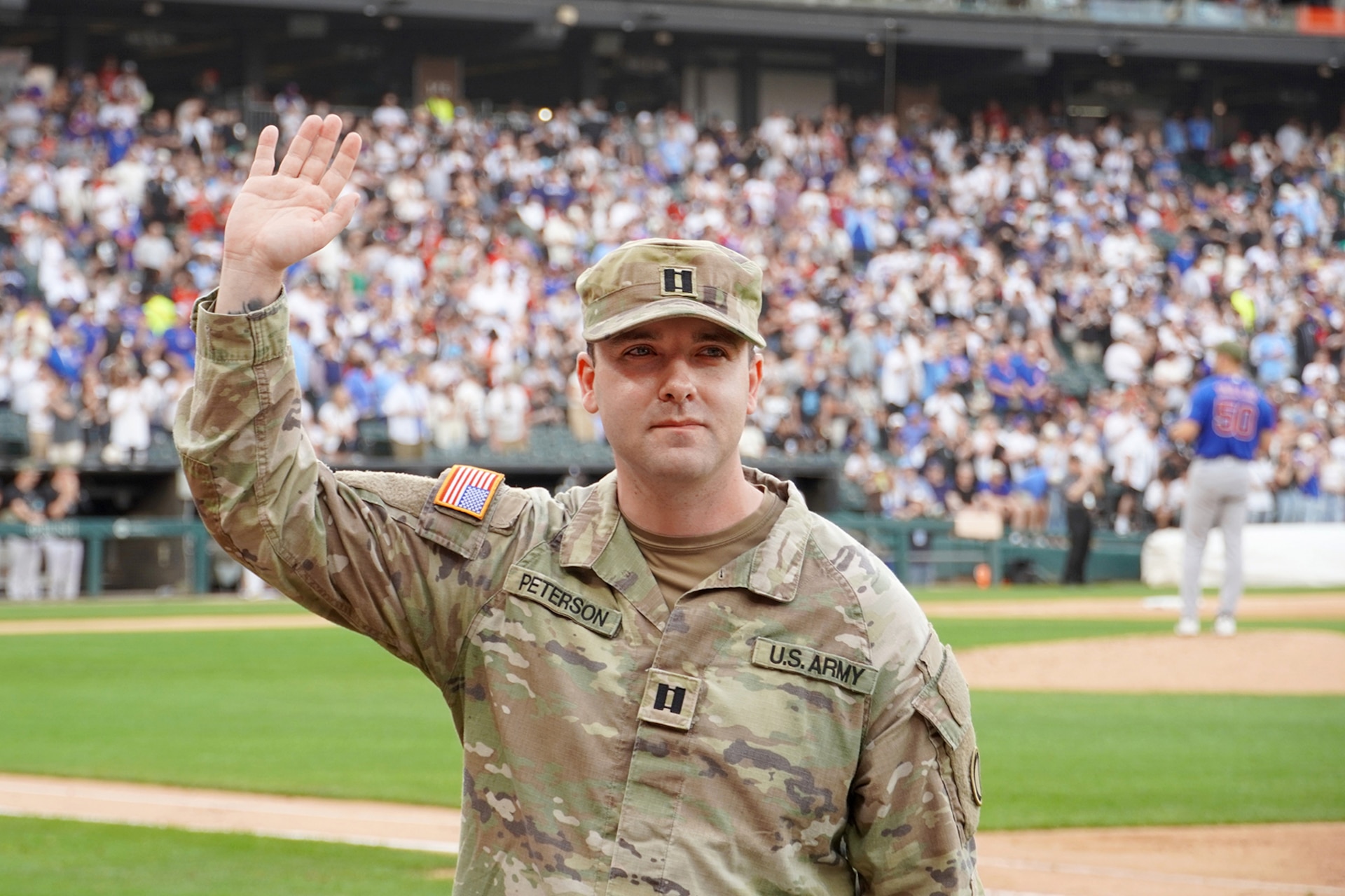 Capt. Justin Peterson, 85th U.S. Army Reserve Support Command, waves to cheering fans during the military recognition at the Chicago White Sox home game, May 16, 2026, at Rate Field.
