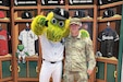 Capt. Justin Peterson, 85th U.S. Army Reserve Support Command, meets Southpaw, the Chicago White Sox’ mascot, after a military recognition during a Chicago White Sox Crosstown Classic game series verses the Chicago Cubs, May 5, 2026, at Rate Field.