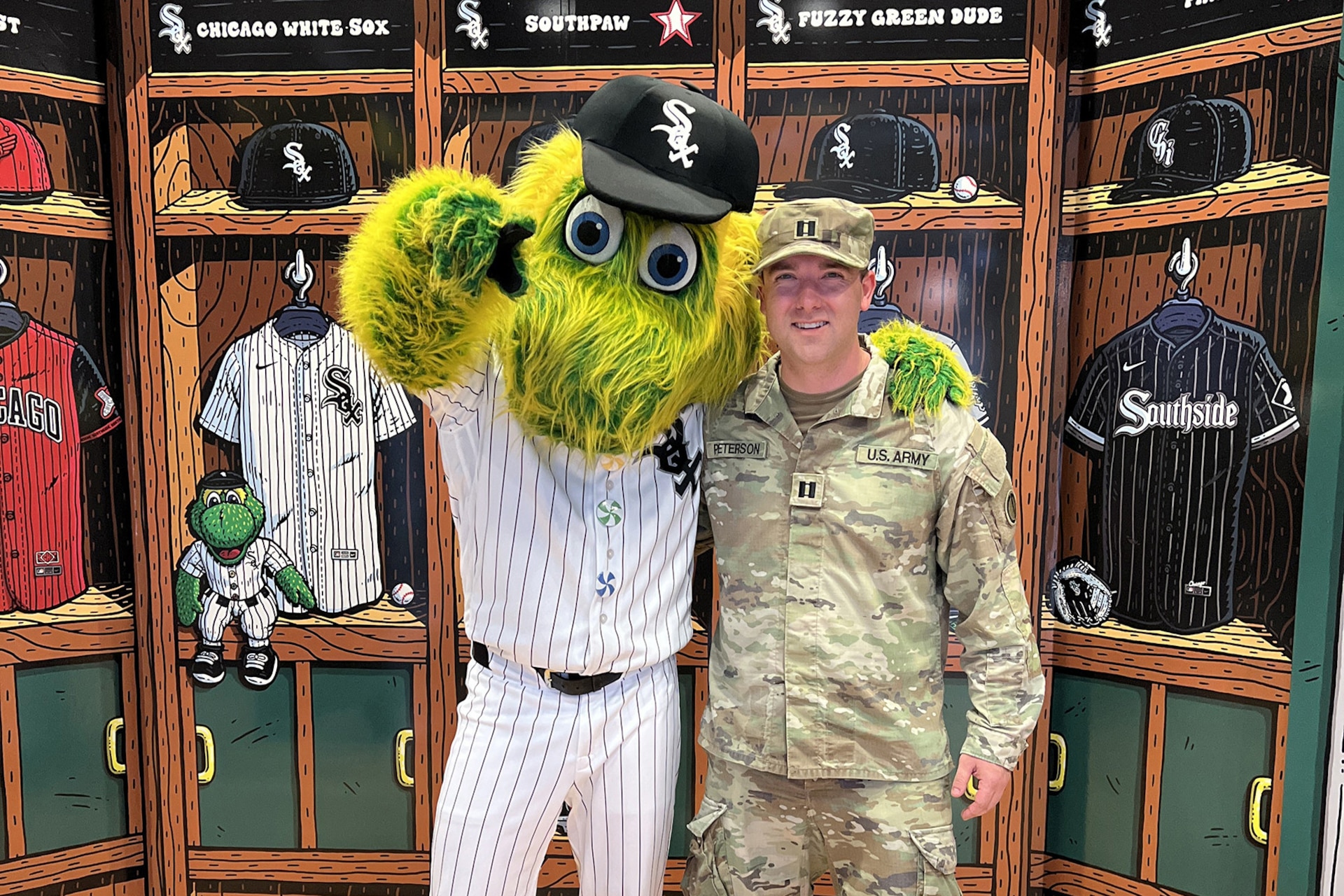 Capt. Justin Peterson, 85th U.S. Army Reserve Support Command, meets Southpaw, the Chicago White Sox’ mascot, after a military recognition during a Chicago White Sox Crosstown Classic game series verses the Chicago Cubs, May 5, 2026, at Rate Field.