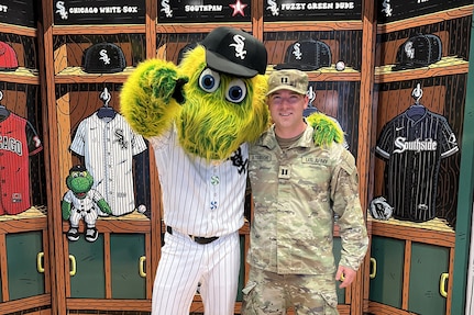 Capt. Justin Peterson, 85th U.S. Army Reserve Support Command, meets Southpaw, the Chicago White Sox’ mascot, after a military recognition during a Chicago White Sox Crosstown Classic game series verses the Chicago Cubs, May 5, 2026, at Rate Field.