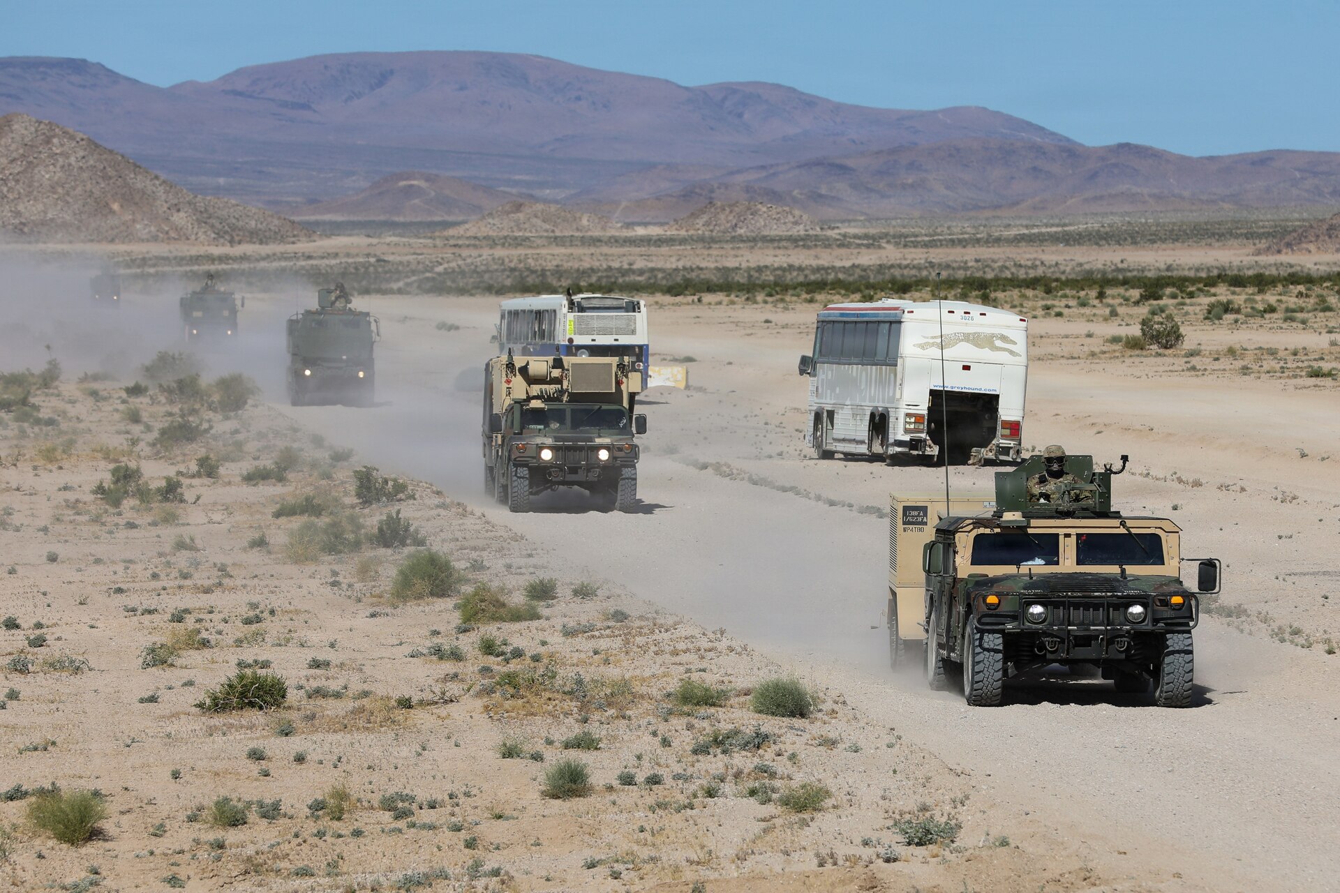 U.S. Army National Guard Soldiers with Kentucky's Bravo Battery, 1st Battalion, 623rd Field Artillery travel in a convoy to the rally point for live-fire exercises on Fort Irwin, California, April 24, 2026.