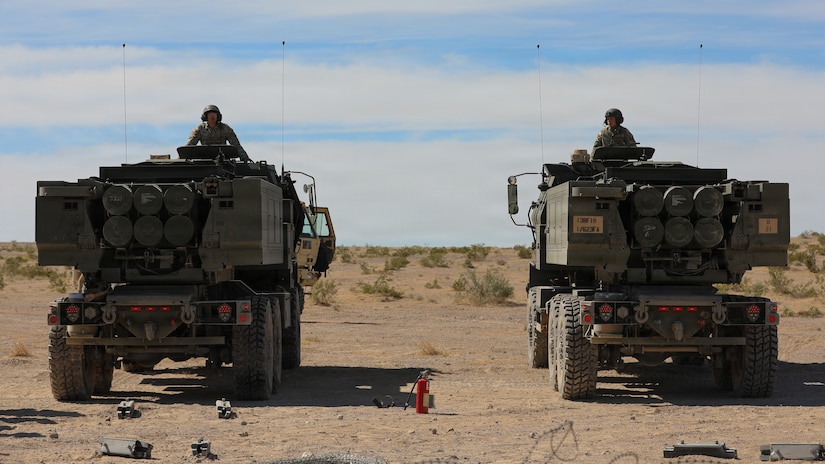 U.S. Army Spc. Vincent Lysons and Spc. Colton Tucker with Kentucky's Bravo Battery, 1st Battalion, 623rd Field Artillery, supervise the loading of rocket pods into the HIMARS in preparation for a live-fire exercise on Fort Irwin, California, April 24, 2026.