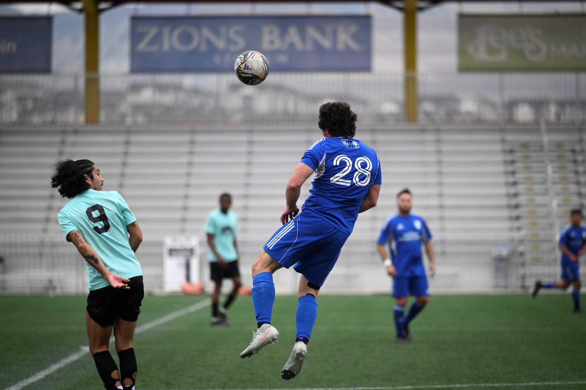 Zanner Cutler, an IT specialist with the Air Force Nuclear Weapons Center at Hill, heads the ball during a Commanders Cup match.