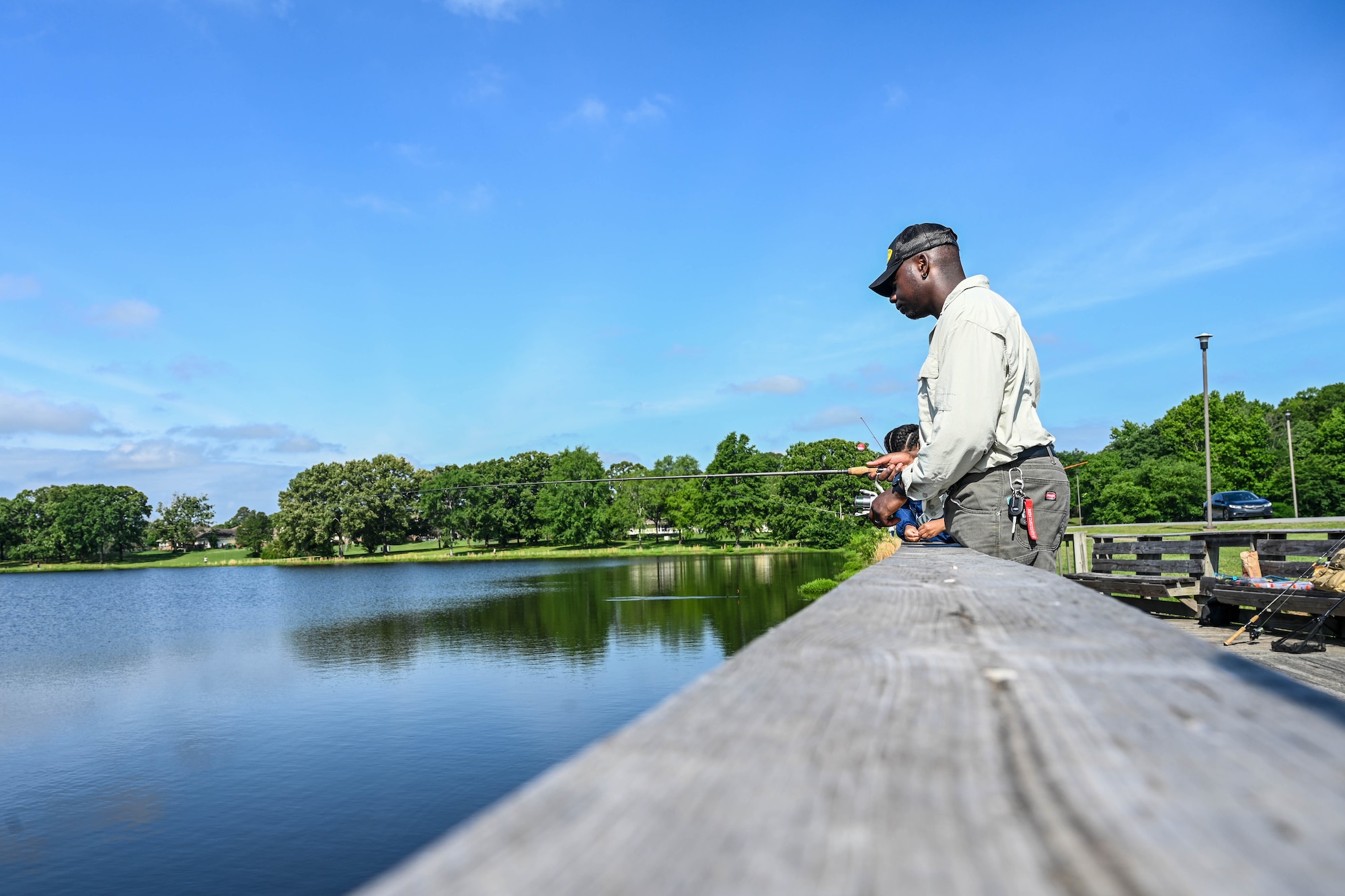 People fish at a dock