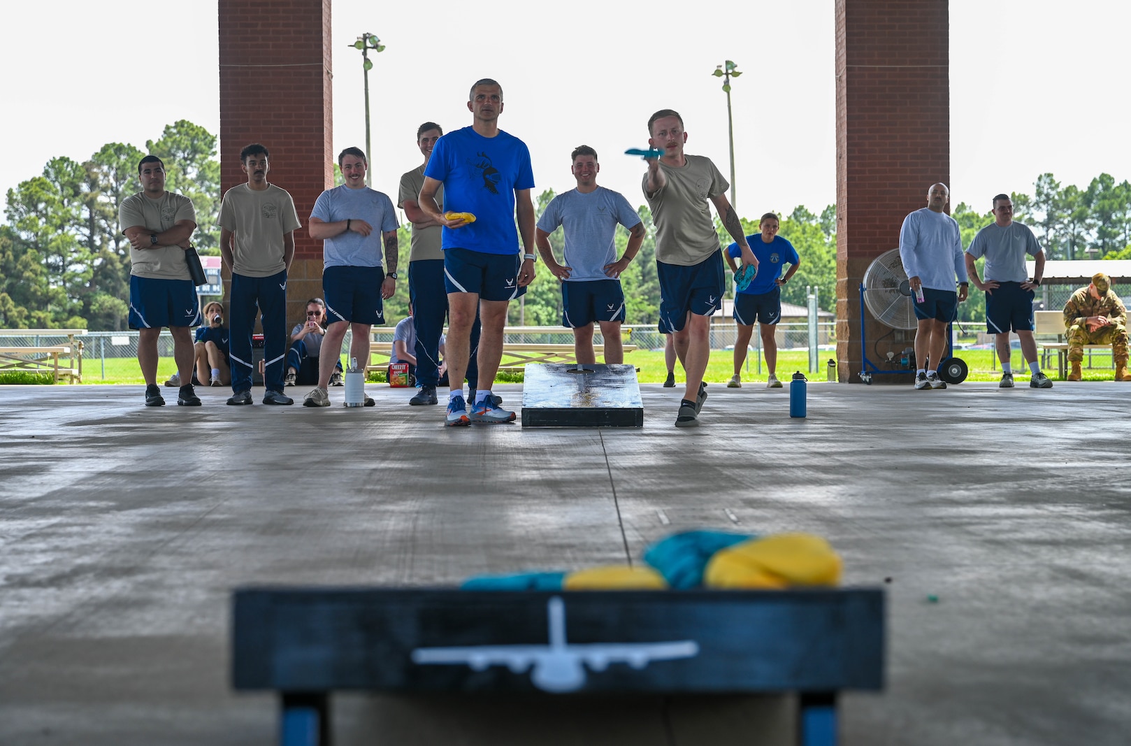 Airmen play cornhole during sports day.