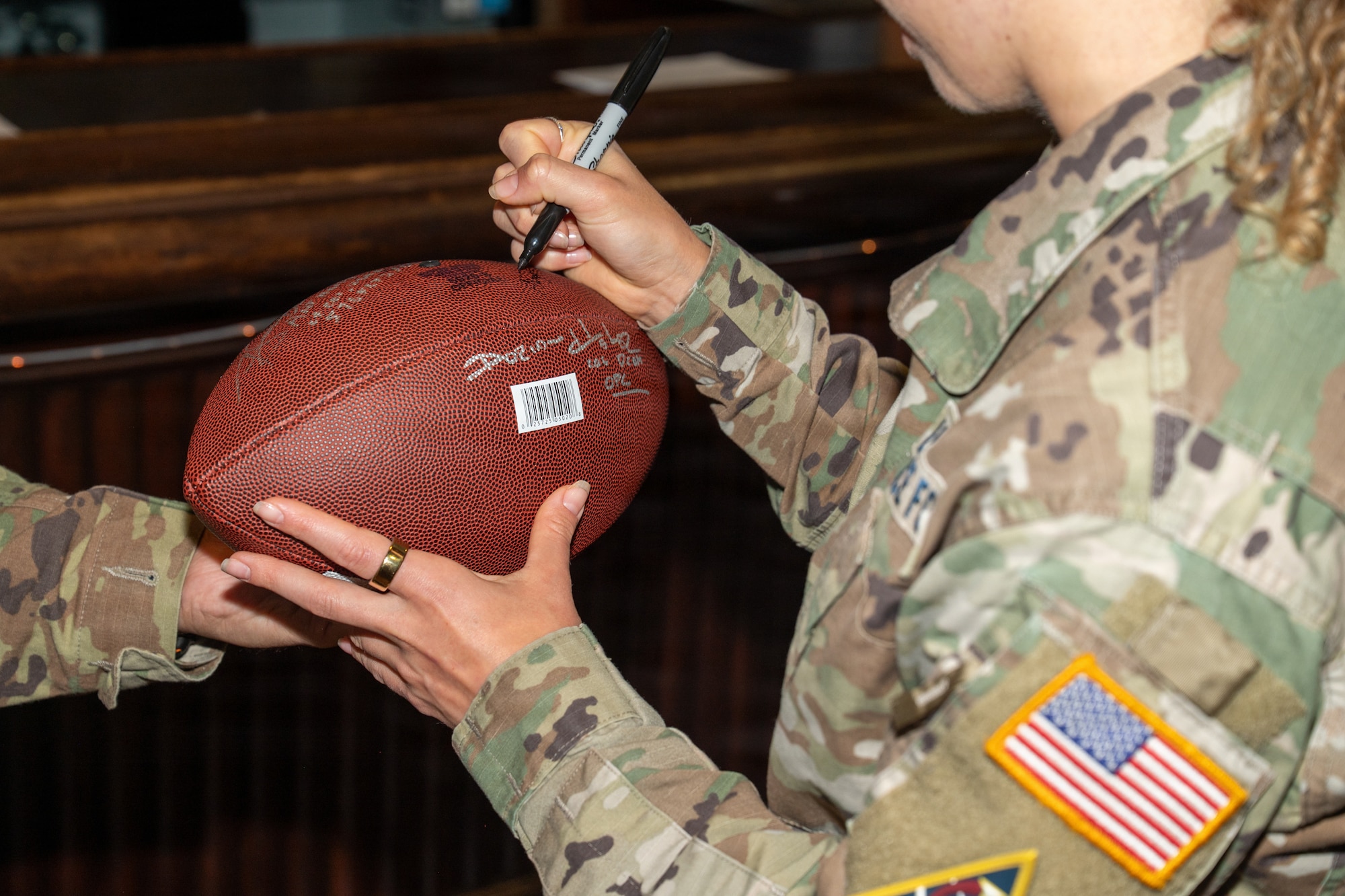 A football is signed.