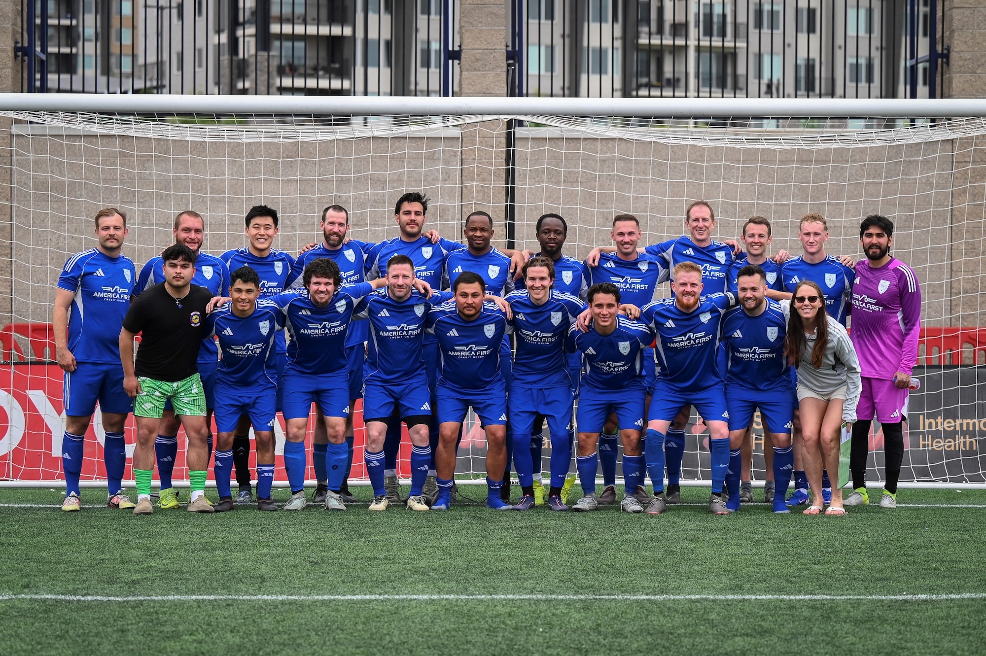 Members of the team gather for a photo after a win that advanced them to the semifinals of the Commanders Cup at Zions Bank Training Center.