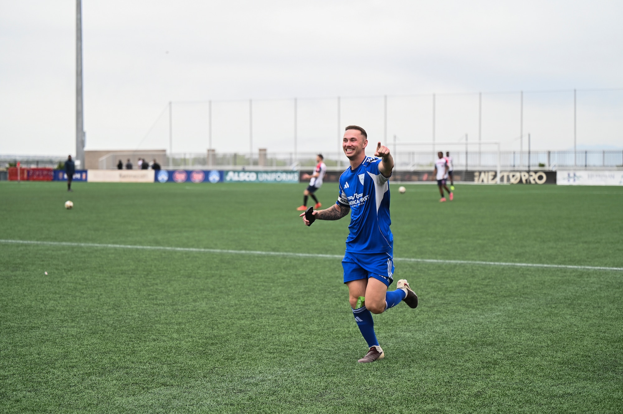 Senior Airman Evan Teaney, coach of the base soccer team and an outbound assignments technician with the 75th Force Support Squadron, smiles after a win during the Commanders Cup at Zions Bank Training Center.