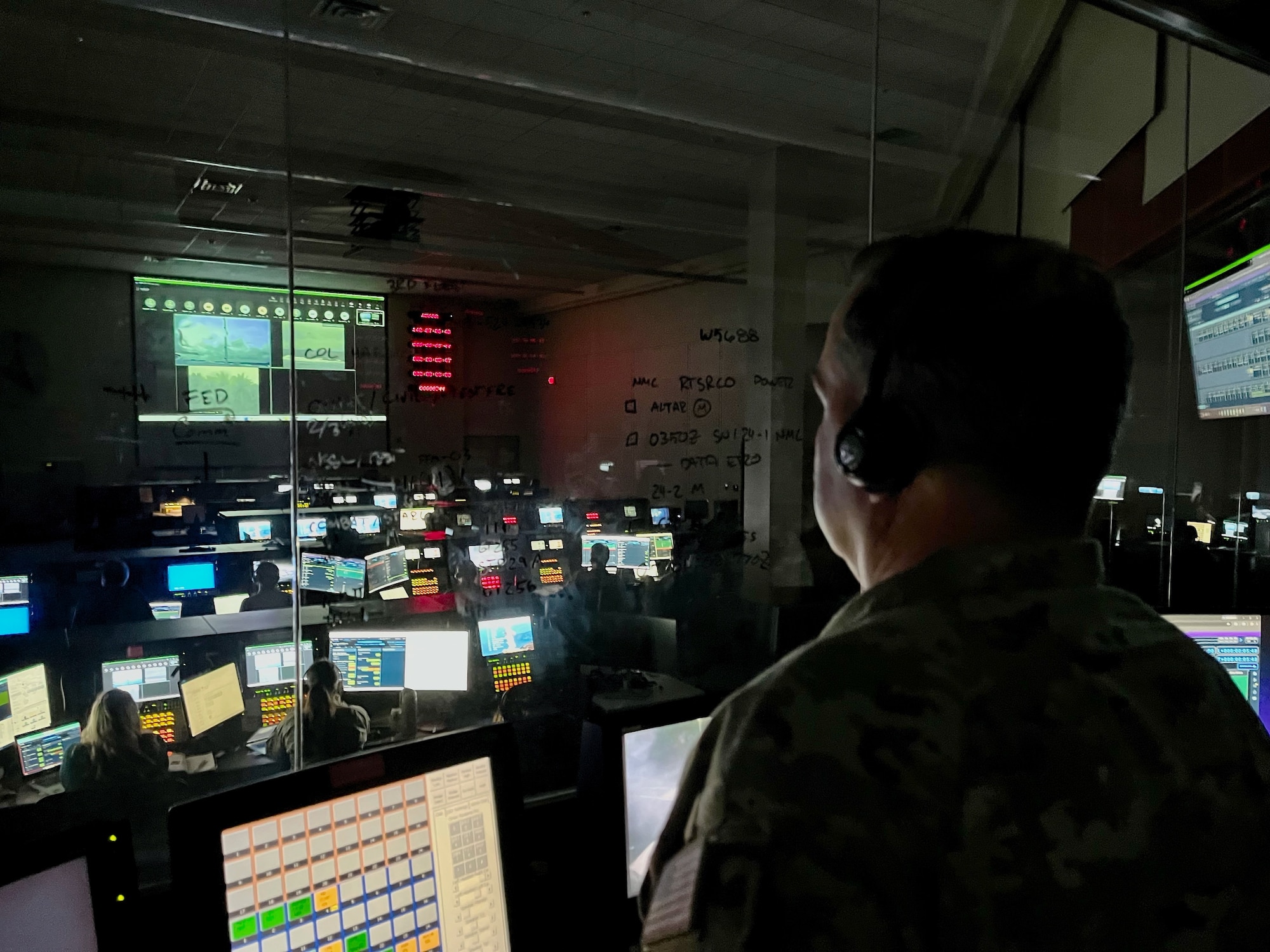 U.S. Space Force Col. Dorian Hatcher looks out over the launch operations floor.
