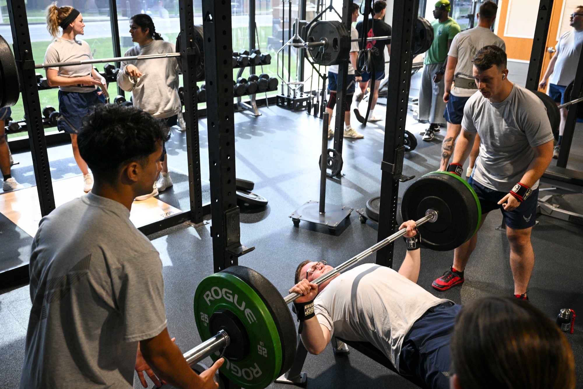 A man conducts a bench press.