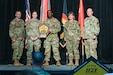 Maj. Gen. Susie Kuilan, commander of the 200th Military Police Command United States Army Reserve, Fort Meade Maryland(far right) and other members of the 200th, accept an award from Lt. Gen. David Francis, Center for Initial Military Training (CIMT) commanding general (far left) for 