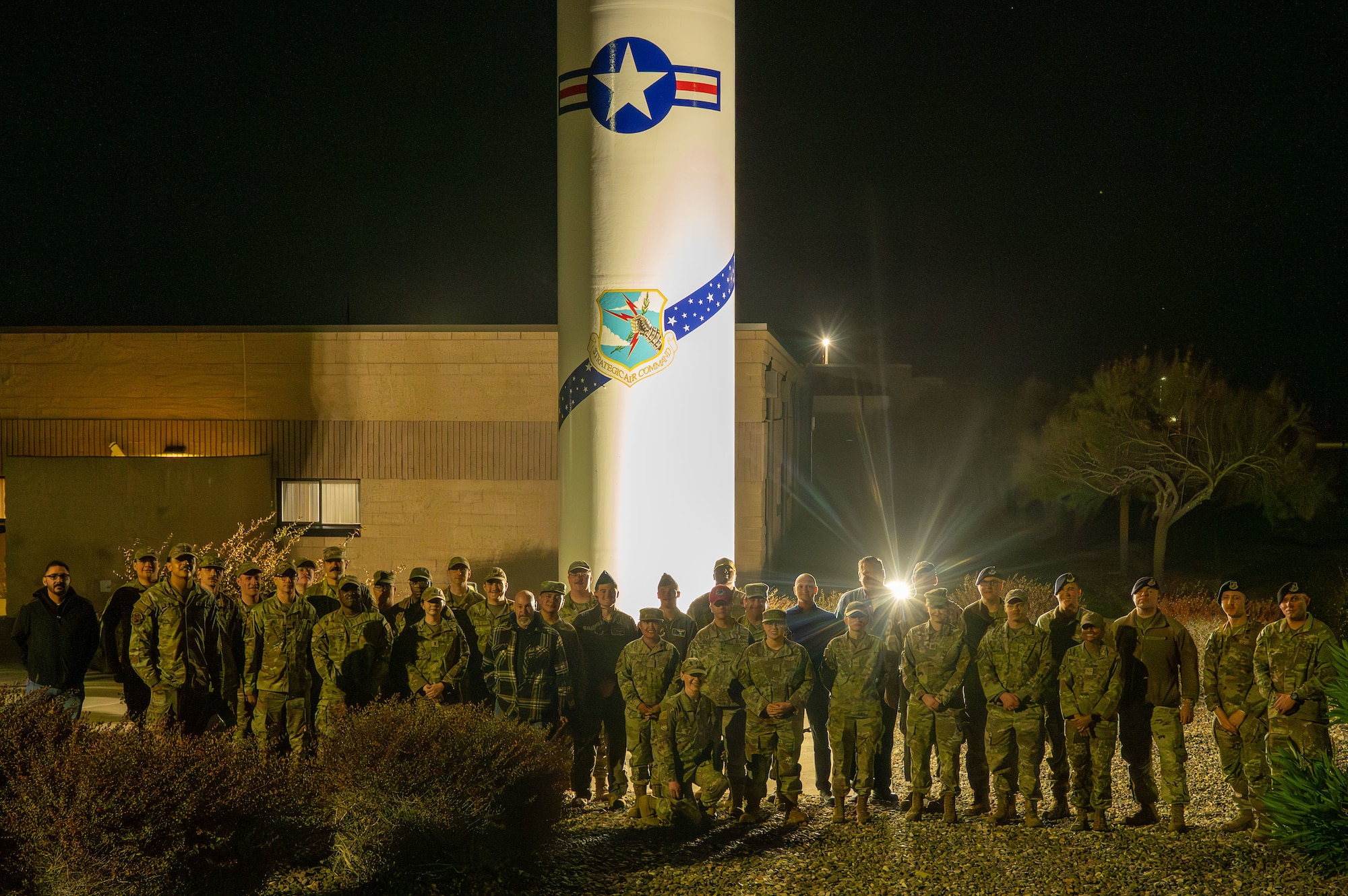 Personnel assigned to Malmstrom Air Force Base, Montana, take a group photo outside the 377th Test and Evaluation Group at Vandenberg Space Force Base, California.