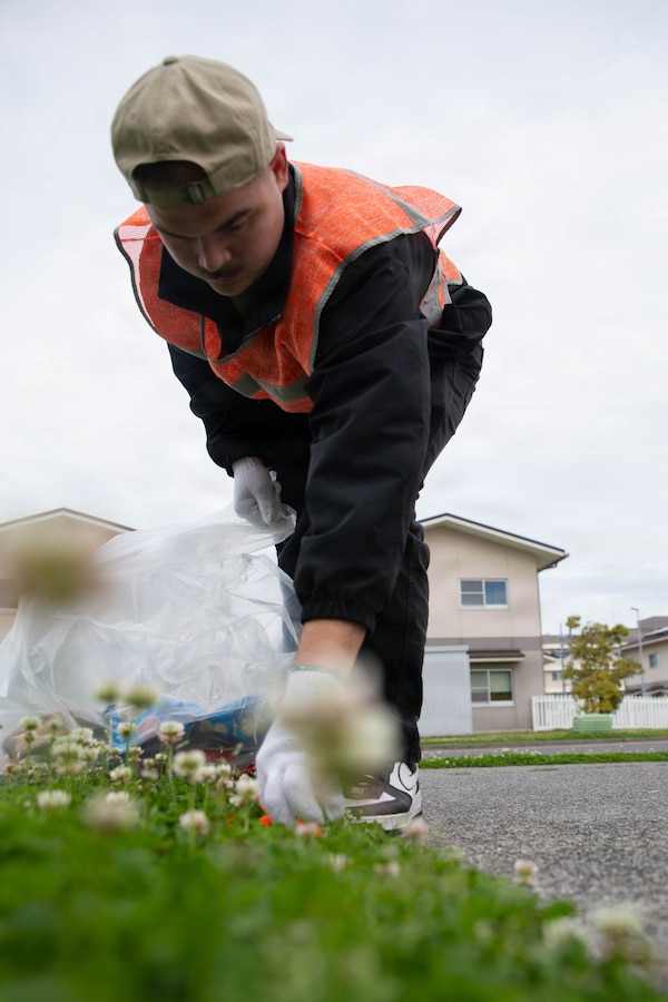 U.S. Marine Corps Lance Cpl. Jase Graziano, a combat videographer with Armed Forces Network Iwakuni, and a native of Easton, Pennsylvania, picks up trash during a volunteer clean-up event hosted by the Marine Corps Air Station Iwakuni Single Marine Program at MCAS Iwakuni, Japan, April 24, 2026. The MCAS Iwakuni SMP hosted a clean-up as part of the SMP Days of Service, a five-day clean-up event to improve community relations both on and off the installation. (U.S. Marine Corps photo by Lance Cpl. Siwan Lewis)