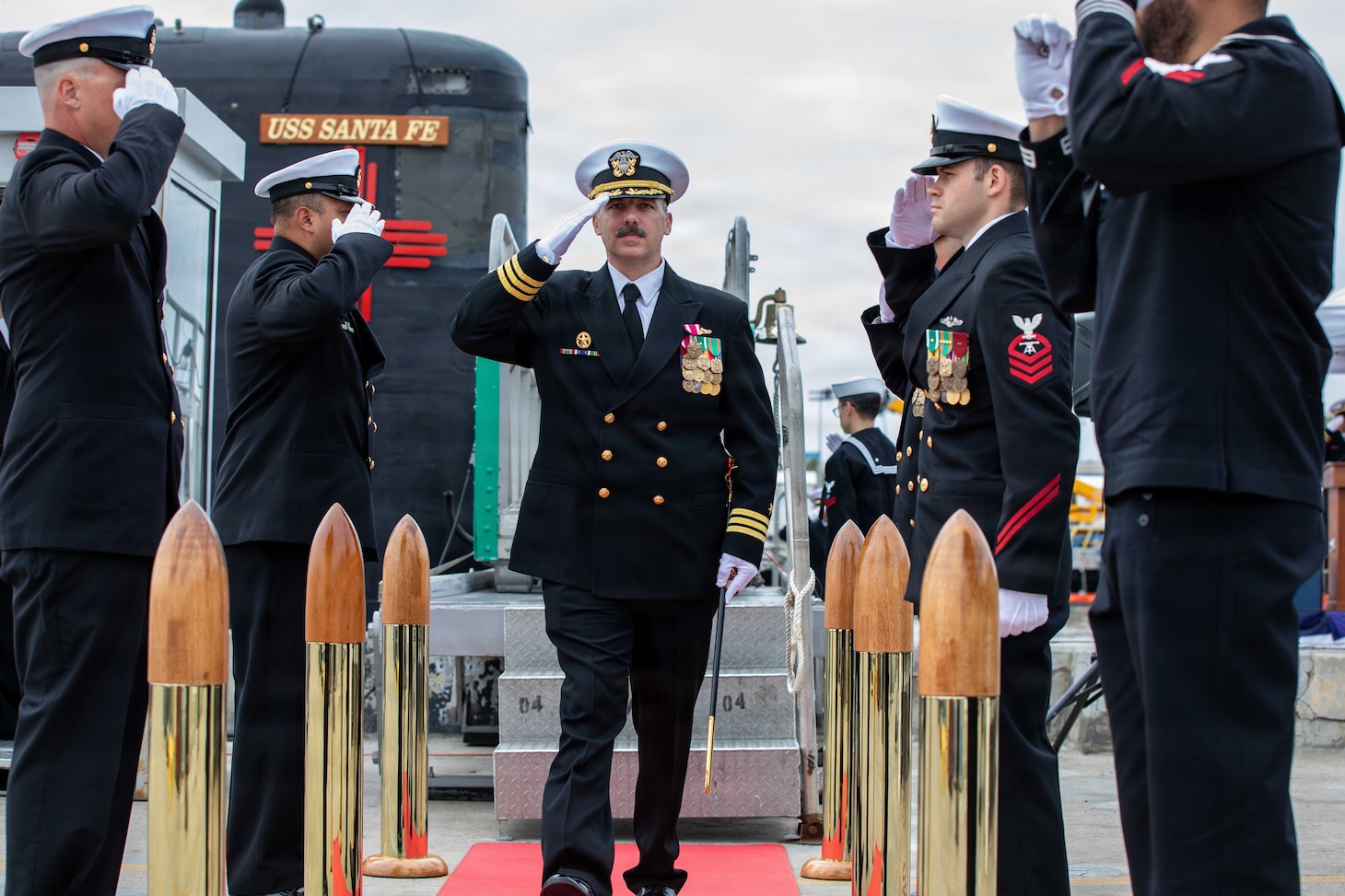NAVAL BASE POINT LOMA, Calif. (May 15, 2026) – Cmdr. Eric Knepper renders a salute to side boys following the change of command ceremony for Los Angeles-class fast-attack submarine USS Santa Fe (SSN 763) onboard Naval Base Point Loma, May 15, 2026. During the ceremony, Knepper was relieved by Cmdr. Miguel Recalde as commanding officer of Santa Fe. Santa Fe is assigned to Commander, Submarine Squadron 11, home to four Los Angeles-class fast-attack submarines which are capable of supporting various missions, including anti-submarine warfare, anti-ship warfare, strike warfare and intelligence, surveillance and reconnaissance. (U.S. Navy photo by Mass Communication Specialist 2nd Class Rashan Jefferson)