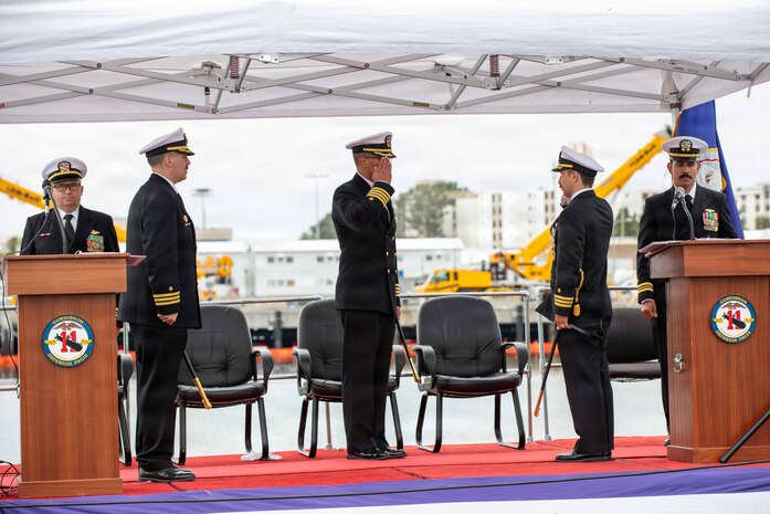 NAVAL BASE POINT LOMA, Calif. (May 15, 2026) – Cmdr. Miguel Recalde, right, renders a salute to Capt. Phillip Sylvia Jr., middle, commander, Submarine Squadron 11, during the change of command ceremony for Los Angeles-class fast-attack submarine USS Santa Fe (SSN 763) onboard Naval Base Point Loma, May 15, 2026. During the ceremony, Cmdr. Eric Knepper was relieved by Recalde as commanding officer of Santa Fe. Santa Fe is assigned to Commander, Submarine Squadron 11, home to four Los Angeles-class fast-attack submarines which are capable of supporting various missions, including anti-submarine warfare, anti-ship warfare, strike warfare and intelligence, surveillance and reconnaissance. (U.S. Navy photo by Mass Communication Specialist 2nd Class Rashan Jefferson)