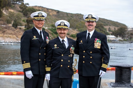 NAVAL BASE POINT LOMA, Calif. (May 15, 2026) – From left to right, Capt. Phillip Sylvia Jr., commander, Submarine Squadron 11, Cmdr. Miguel Recalde, commanding officer, Los Angeles-class fast-attack submarine USS Santa Fe (SSN 763), and Cmdr. Eric Knepper pose for a photo following the change of command ceremony for Santa Fe onboard Naval Base Point Loma, May 15, 2026. During the ceremony, Knepper was relieved by Recalde as commanding officer of Santa Fe. Santa Fe is assigned to Commander, Submarine Squadron 11, home to four Los Angeles-class fast-attack submarines which are capable of supporting various missions, including anti-submarine warfare, anti-ship warfare, strike warfare and intelligence, surveillance and reconnaissance. (U.S. Navy photo by Mass Communication Specialist 2nd Class Rashan Jefferson)