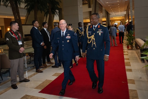 leaders walk down a hall