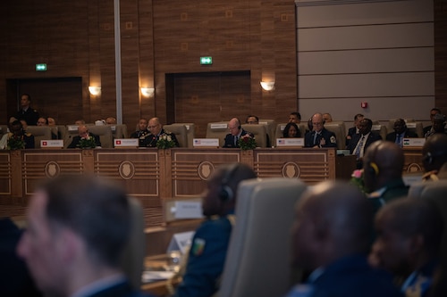 Leaders participate in a conference