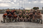 U.S. Marines with Light Armored Reconnaissance Company, Battalion Landing Team 3/6, 22nd Marine Expeditionary Unit (Special Operations Capable), and Ecuadorian Marines pose for a group photo during a bilateral exercise on Naval Base Jaramijó, Ecuador, April 30, 2026. The 22nd MEU (SOC)’s Ecuador bilateral training enhances interoperability with partner forces, reinforces longstanding security relationships, and improves combined readiness to respond to crises across the region. U.S. military forces are deployed to the region in support of U.S. Southern Command mission objectives and the president’s priorities to strengthen regional security, disrupt illicit drug trafficking, and protect the U.S. homeland. (U.S. Marine Corps photo)