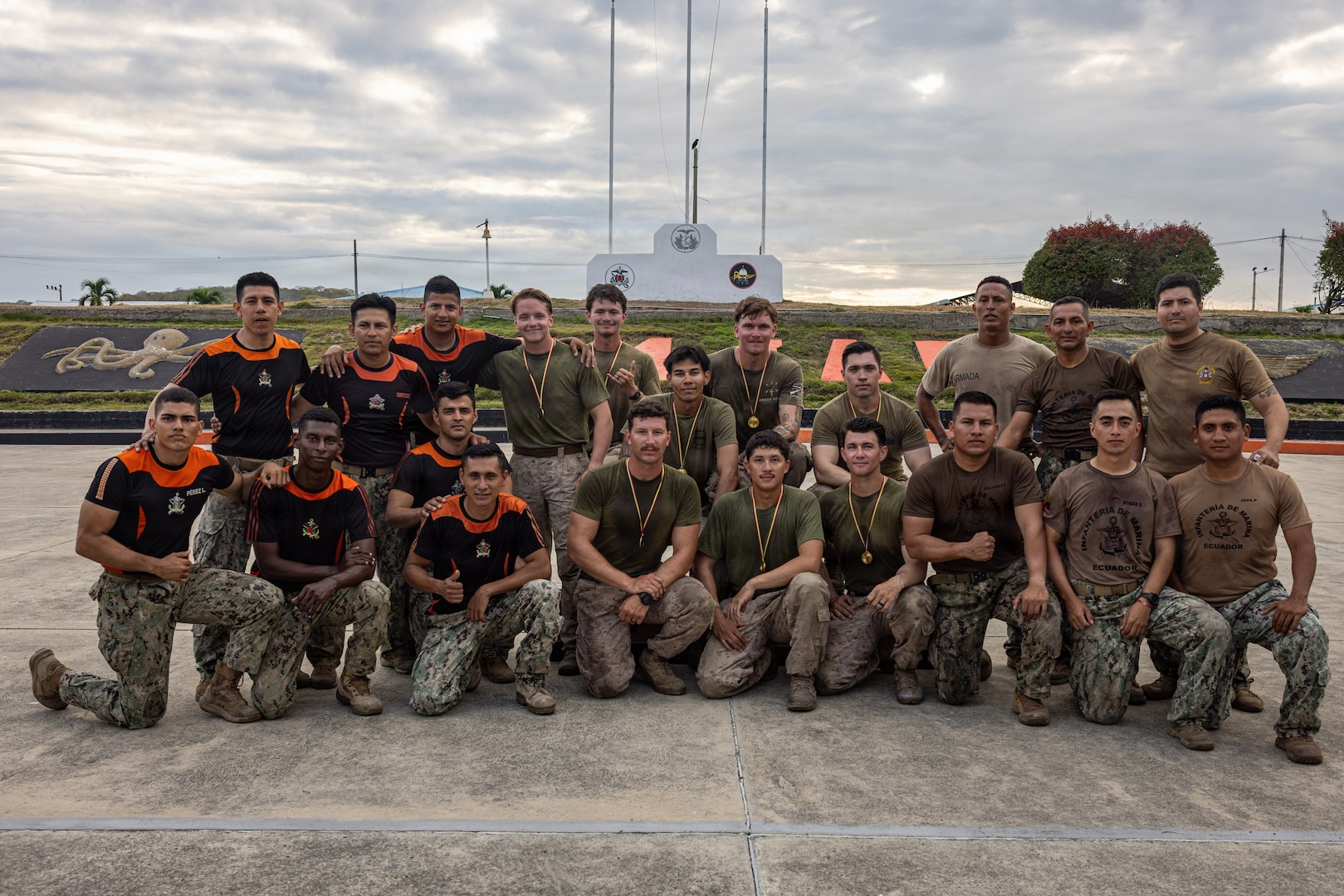 U.S. Marines with Light Armored Reconnaissance Company, Battalion Landing Team 3/6, 22nd Marine Expeditionary Unit (Special Operations Capable), and Ecuadorian Marines pose for a group photo during a bilateral exercise on Naval Base Jaramijó, Ecuador, April 30, 2026. The 22nd MEU (SOC)’s Ecuador bilateral training enhances interoperability with partner forces, reinforces longstanding security relationships, and improves combined readiness to respond to crises across the region. U.S. military forces are deployed to the region in support of U.S. Southern Command mission objectives and the president’s priorities to strengthen regional security, disrupt illicit drug trafficking, and protect the U.S. homeland. (U.S. Marine Corps photo)
