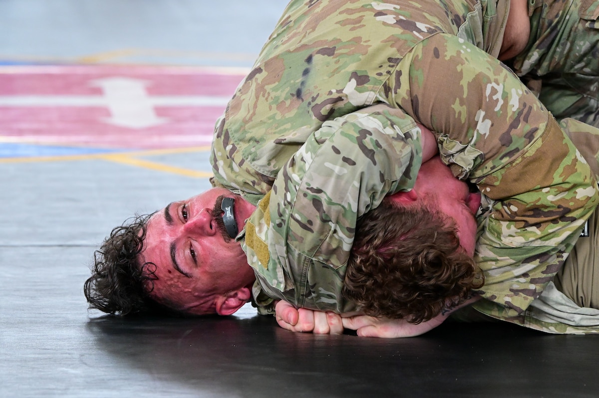 U.S. Security Forces Airmen grapple during the combatives portion of Pacific Air Force’s 9th Annual Advanced Combat Skills Assessment Competition at Andersen Middle School, Andersen Air Force Base, Guam, May 22, 2026.