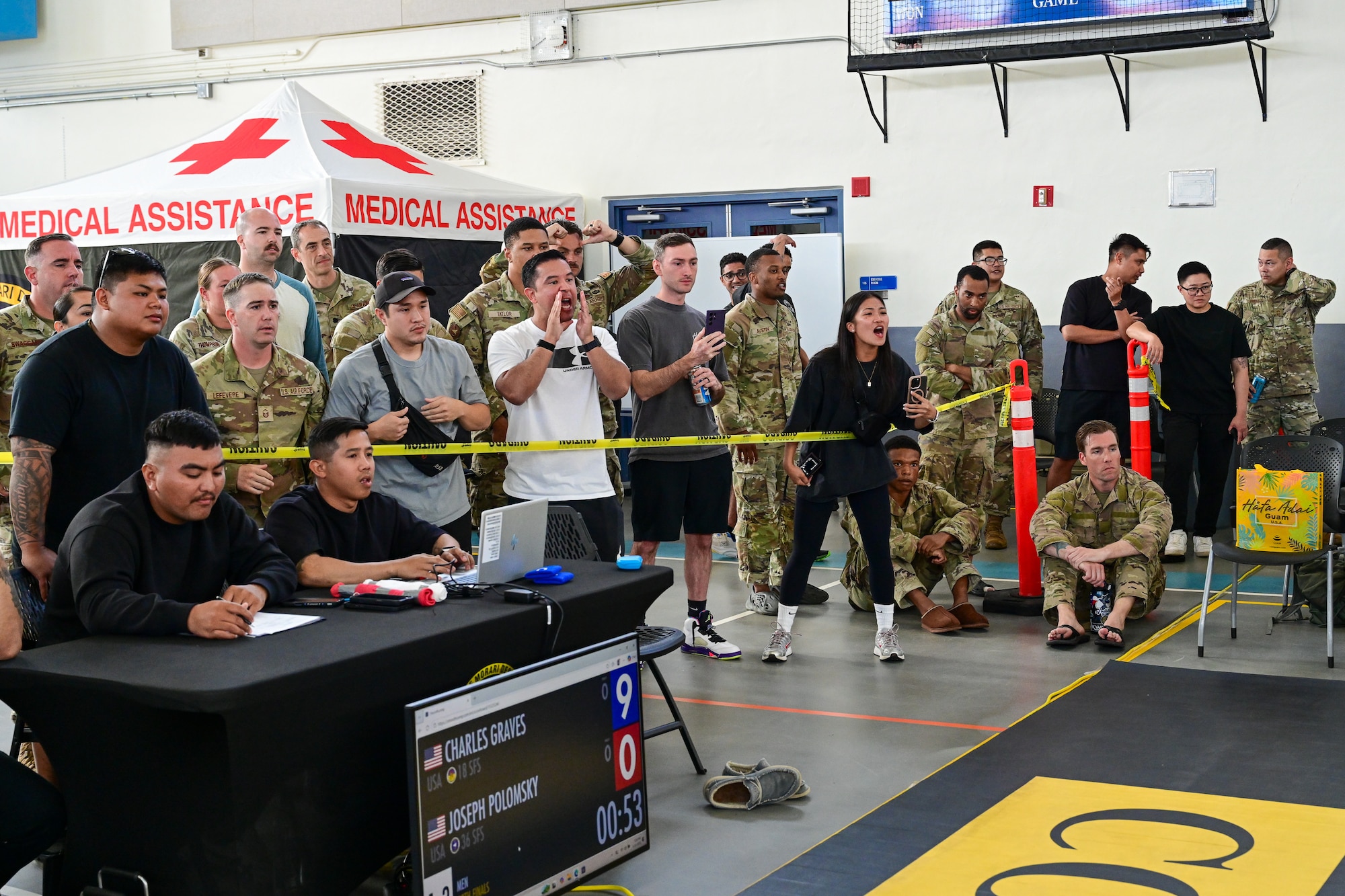Spectators cheer for competitors during the combatives portion of Pacific Air Force’s 9th Annual Advanced Combat Skills Assessment Competition at Andersen Middle School, Andersen Air Force Base, Guam, May 22, 2026.