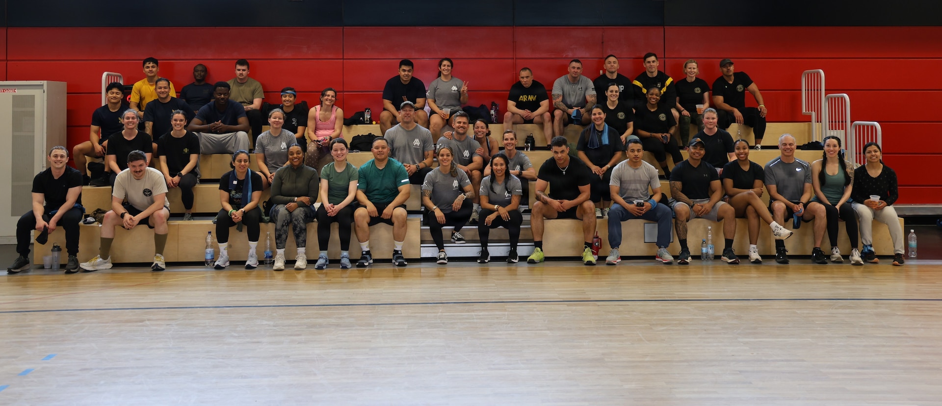 Participants celebrate their physical and mental resilience following the Team Fitness Competition at the Landstuhl Regional Medical Center fitness center, May 18. The fitness challenge served as the culmination of a month-long campaign for Mental Health Awareness Month, highlighting the critical link between physical readiness and mental well-being.