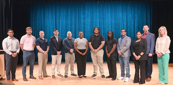 Mentors from Marine Corps Logistics Command and students from Albany State University pose for a group photo following the Spring 2026 Internship Cohort Capstone Symposium. Pictured from left to right are GySgt Jeka Talaa (LOGCOM), Jack Sanders (LOGCOM), Lt. Col. Matthew Miller (LOGCOM), Capt. Lane Johnson (LOGCOM), Garret Godwin (ASU), Lauren Flournoy (ASU), Emery Allen (ASU), Javian Mack (ASU), Griffin Sanders (ASU), Mackenzie Howard (ASU), Mr. Craig Clemans (LOGCOM), and Michelle Blalock (LOGCOM).