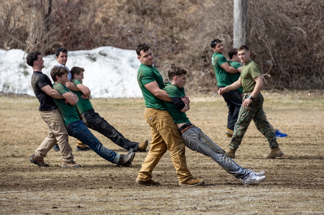 U.S. Marine Corps officer candidates with 1st Marine Corps District perform a buddy drag during Mini Officer Candidate School (OCS) at Norwich University, Northfield, Vermont, April 4, 2026. Mini OCS provides applicants and candidates a glimpse into Officer Candidate School by placing them through an intense training environment designed to test their endurance, resiliency, and courage. (U.S. Marine Corps photo by Sgt. Hernan Rodriguez)