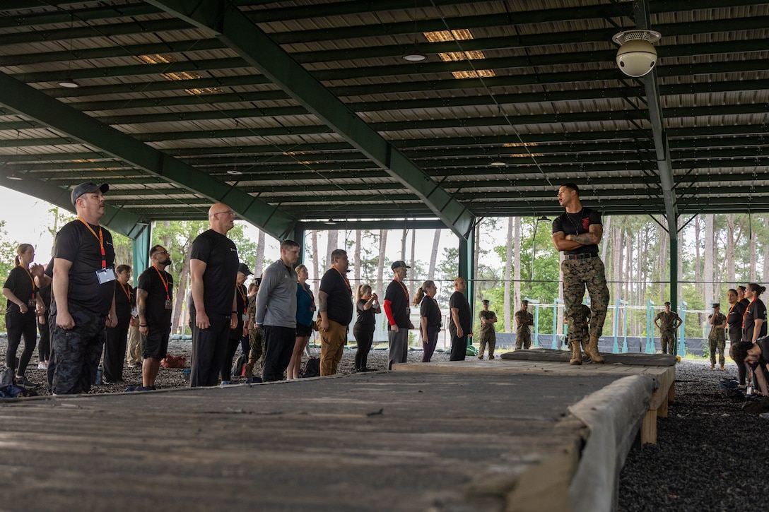 U.S. Marine Corps Staff Sgt. David Rodriguez, a Marine Corps Martial Arts Program (MCMAP) instructor with Support Battalion, Recruit Training Regiment, explains the purpose of MCMAP during Educators Workshop at Marine Corps Recruit Depot Parris Island, South Carolina, April 22, 2026. Educators Workshop is designed to demystify recruit training, foster stronger relationships among recruiting personnel and the communities they serve, and increase advocacy among influencers who help shape decisions of young men and women. (U.S. Marine Corps photo by Sgt. Hernan Rodriguez)