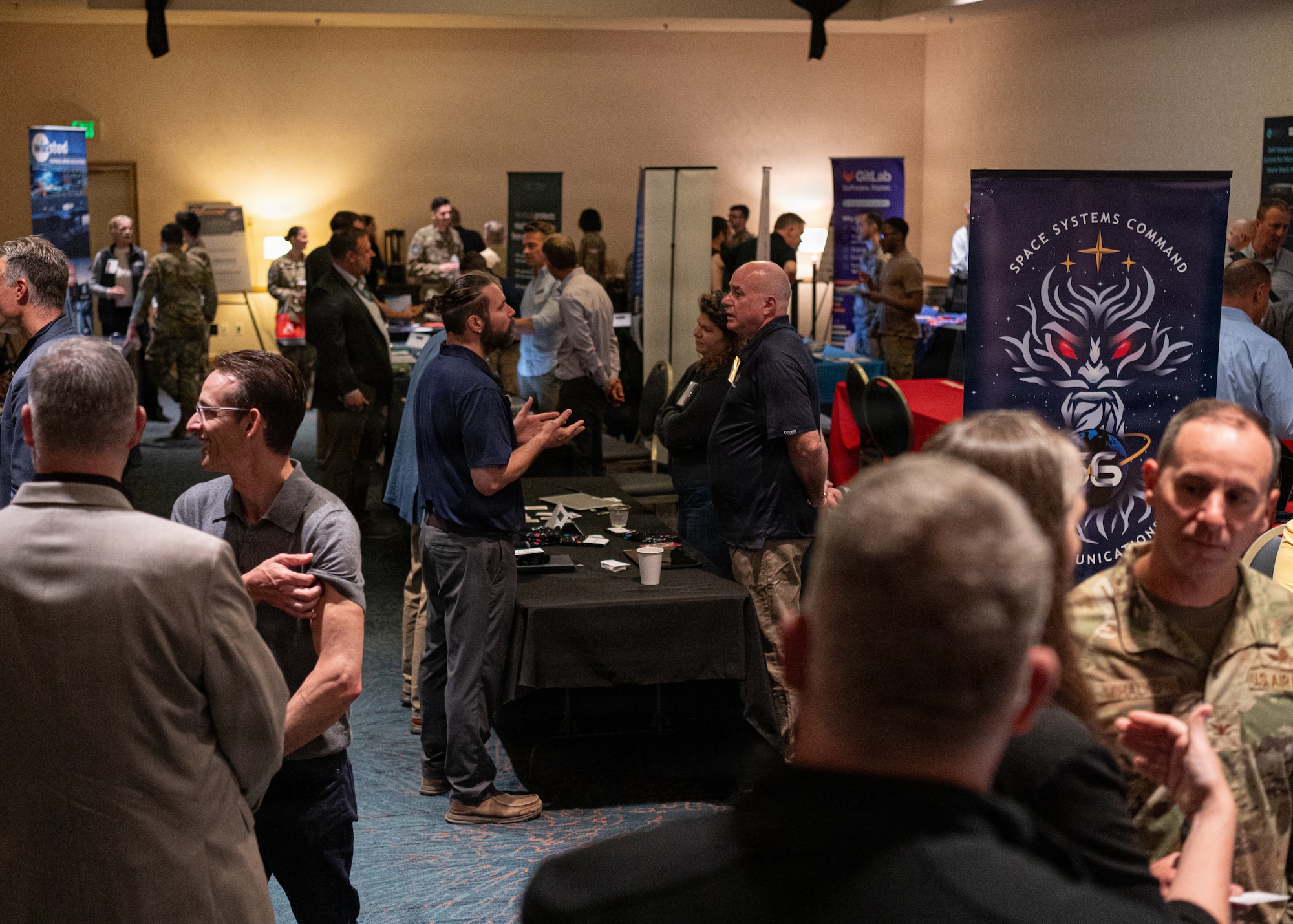 Team Vandenberg Guardians, Airmen, and government civilians and contractors attend the Space Systems Command Cyber Expo 2026 hosted at the Pacific Coast Center at Vandenberg Space Force Base, Calif., May 14, 2026. Guardians, Airmen, and government civilians had the opportunity to visit with commercial industry leaders in areas such as cybersecurity, network operations, acquisitions and technical evaluation, strategic planning methodologies, and more. (U.S. Space Force photo by Tech. Sgt. Draeke Layman)