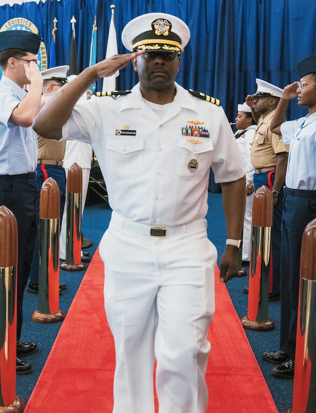 Man renders a salute.