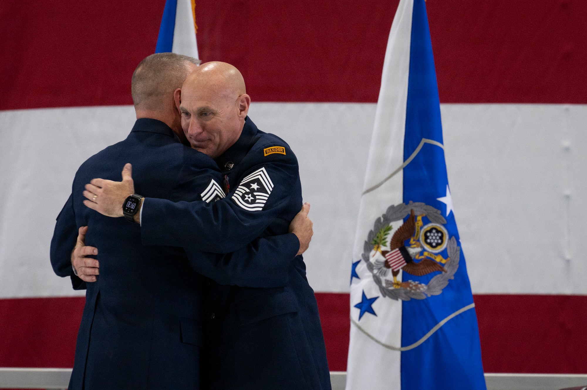 Two Airmen hug