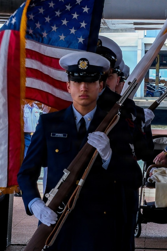 U.S. Coast Guard Petty Officer 3rd Class Anthony Sprando, assigned to Sector New York, conducts ceremonial honor guard duties during the commissioning ceremony of USCGC Vincent Danz (WPC 1162) at Pier 86 near the Intrepid Museum in New York, May 22, 2026. Honor guard members participated in the ceremony honoring the cutter’s namesake and legacy of service. (U.S. Coast Guard photo by Seaman Braelynn Greene)