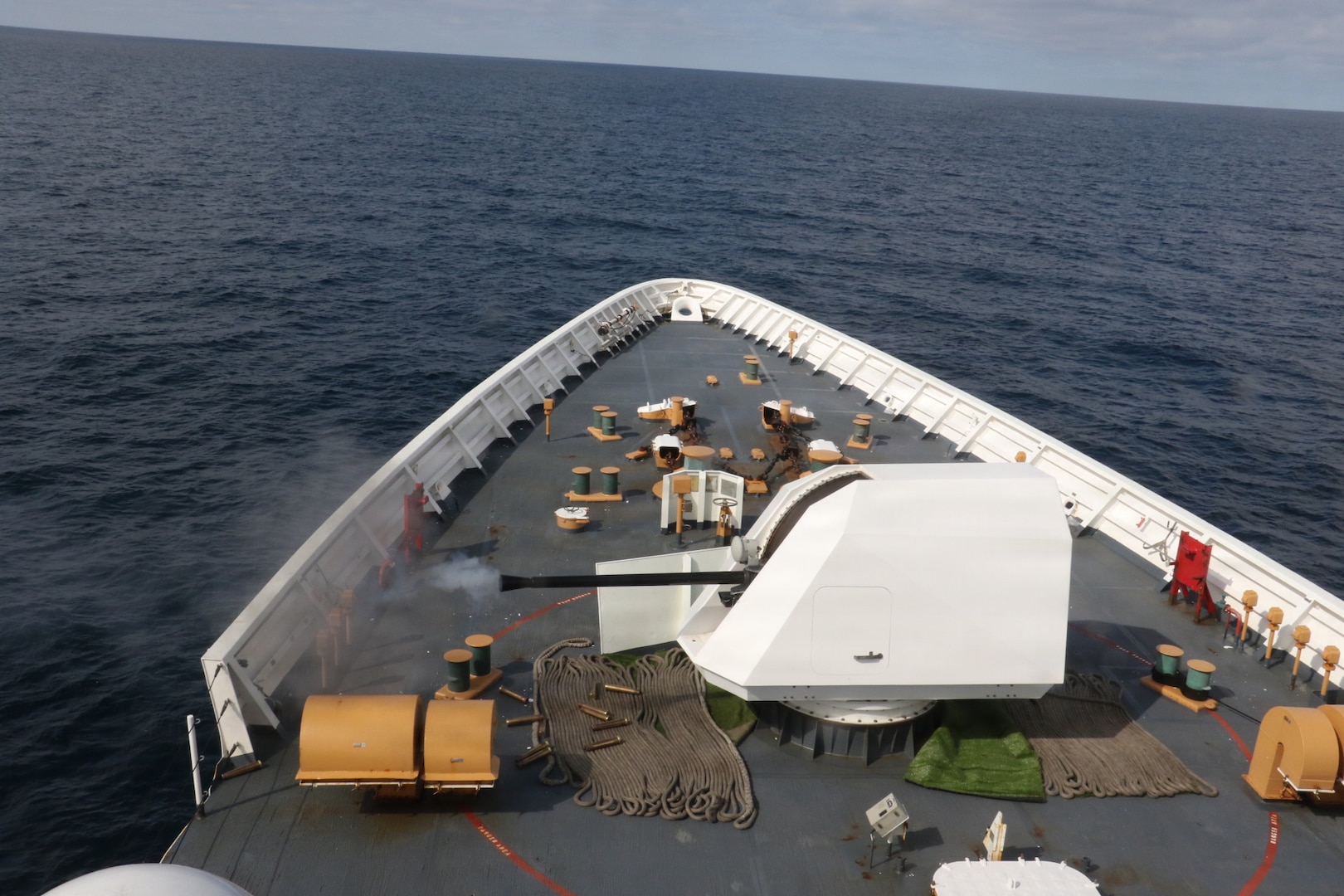 U.S. Coast Guard Cutter Waesche (WMSL 751) conducts a gunnery exercise with its MK-110, 57-millimeter gun in the Bering Sea April 3, 2026. Waesche regularly trains to conduct defense operations as a worldwide deployable cutter. (U.S. Coast Guard photo by Petty Officer 3rd Class Lillian Escoba)