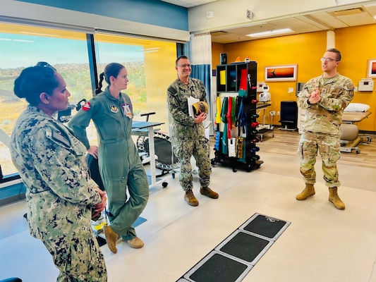 Capt. Janiese Cleckley (left) meets with Col. Mary Carnduff (center-right) and staff assigned to the 412th Medical Group during a tour of medical facilities at Edwards Air Force Base on May 14, 2026. Leaders from Naval Hospital Twentynine Palms visited Edwards Air Force Base to strengthen cross-service collaboration, improve interoperability, and identify new opportunities to enhance medical readiness and healthcare delivery across the Mojave Desert region. (Courtesy photo)