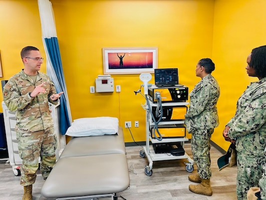 Capt. Janiese Cleckley (center-right) and Cmdr. Christina Carter (right) meet with staff assigned to the 412th Medical Group during a tour of medical facilities at Edwards Air Force Base on May 14, 2026. Leaders from Naval Hospital Twentynine Palms visited Edwards Air Force Base to strengthen cross-service collaboration, improve interoperability, and identify new opportunities to enhance medical readiness and healthcare delivery across the Mojave Desert region. (Courtesy photo)